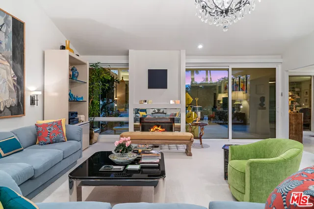 a view of a swimming pool with a patio and a garden