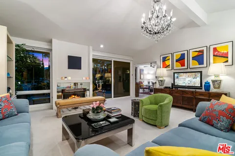 a view of swimming pool with a patio and a garden