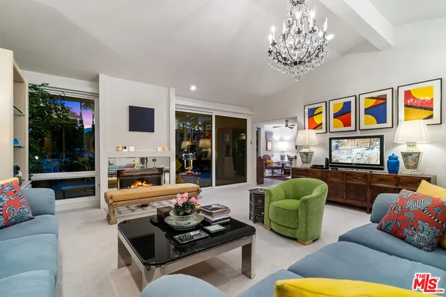 a view of swimming pool with a patio and a garden