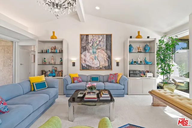a living room with furniture flowerpot and window