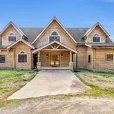a view of entryway with a floor to ceiling window and wooden floor