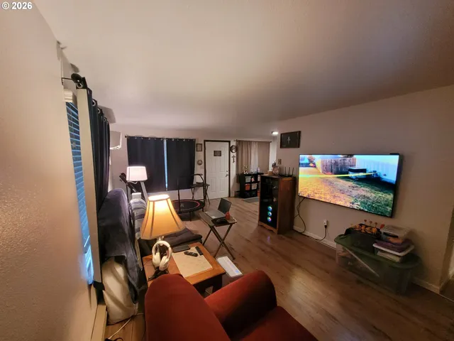 a room with furniture gym equipment and view of bathroom