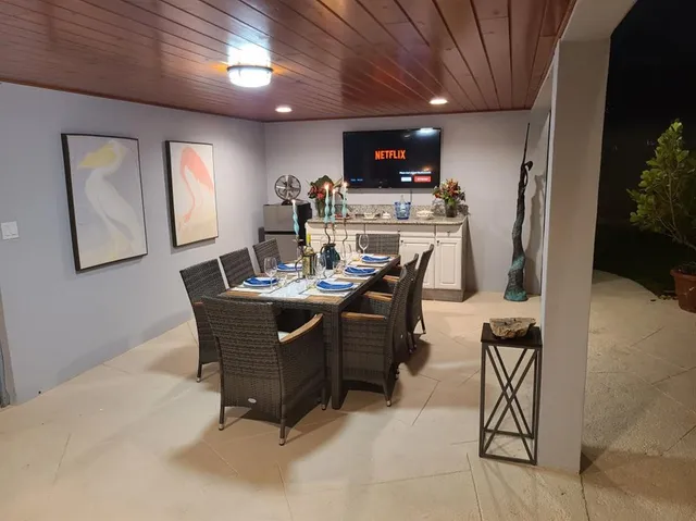 a dining room with furniture and window