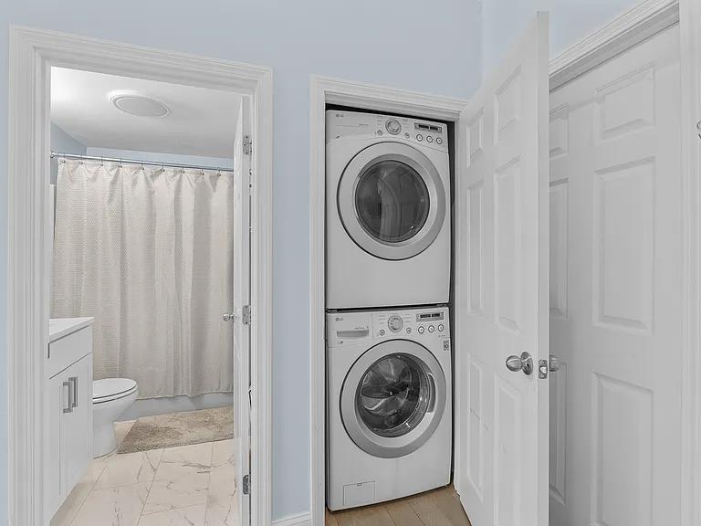 15 Riverview Avenue, Unit D Mashpee, MA 02649 - Photo 20 of 33 a view of a hallway with washer and dryer