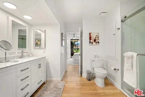 a bathroom with a shower and a sink