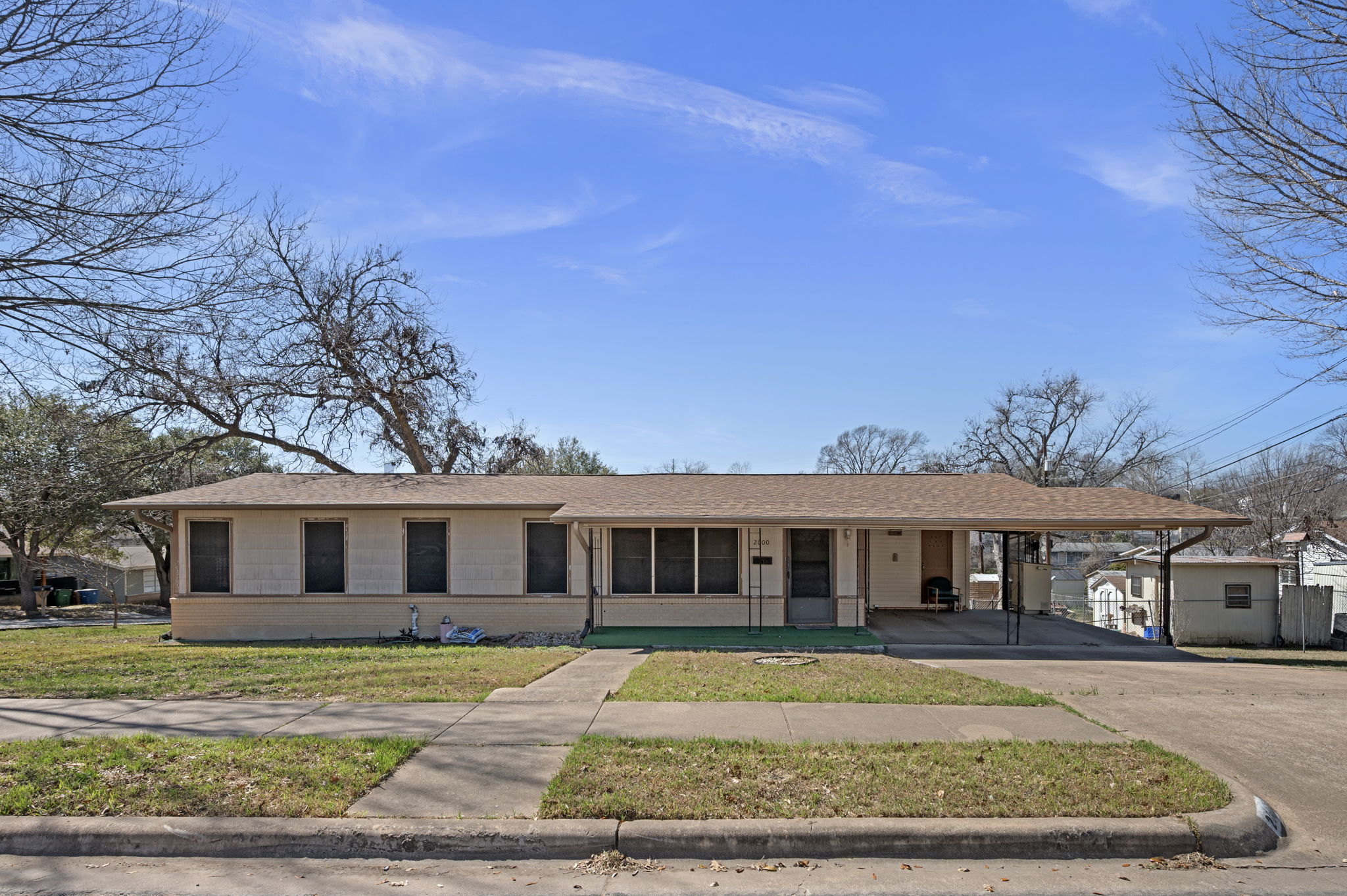 front view of a house with a yard