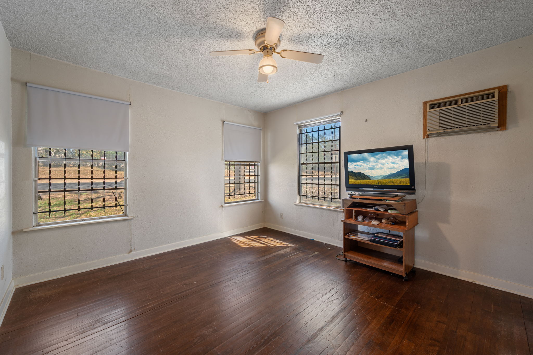 2000 Cedar Avenue Austin, TX 78722 - Photo 13 of 22 a view of room with window and wooden floor