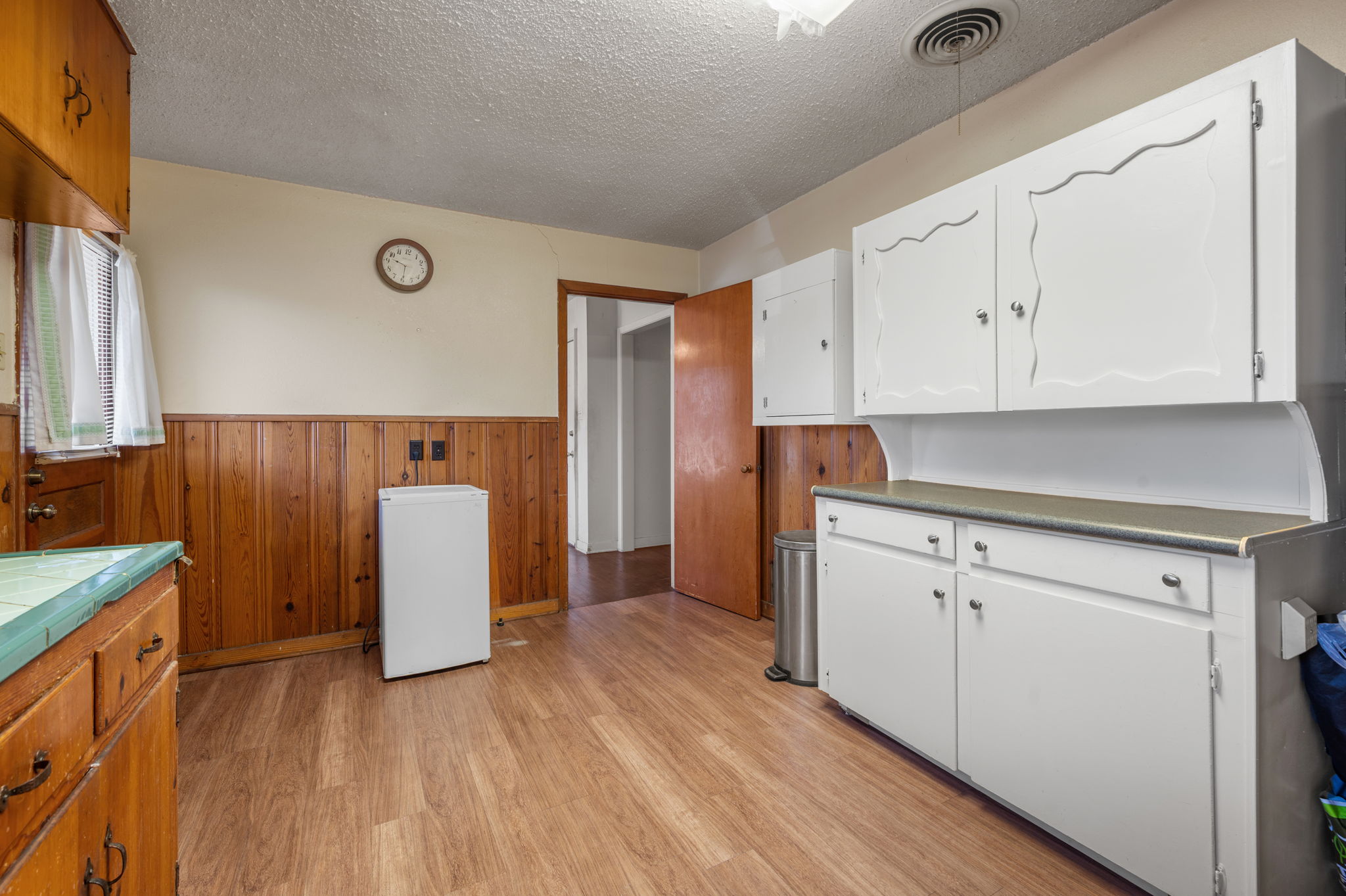 2000 Cedar Avenue Austin, TX 78722 - Photo 8 of 22 a view of kitchen with cabinets and wooden floor