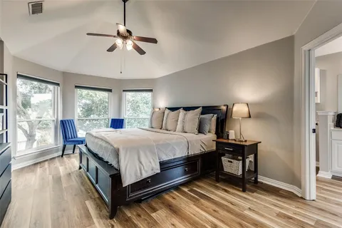 a bed room with a bed and a night stand