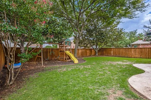 a view of a backyard with a slide