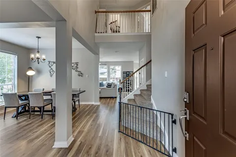 a view of a livingroom with furniture and hardwood floor