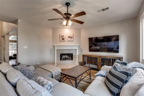 a bedroom with furniture and a fireplace