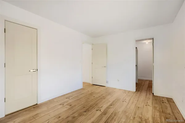 an empty room with wooden floor