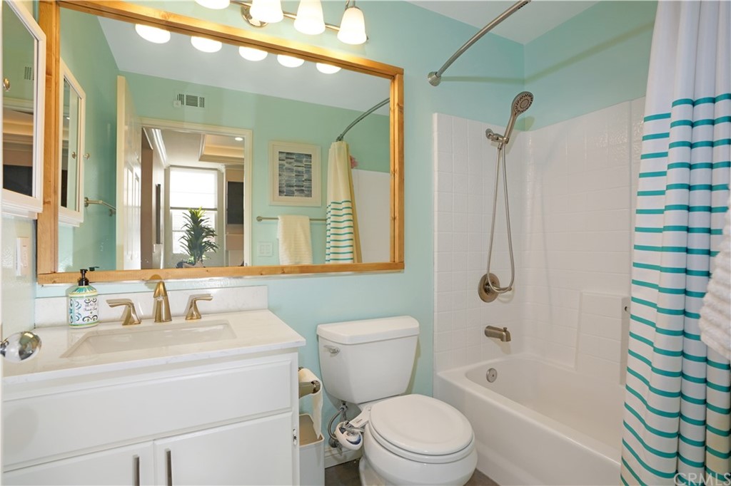 10 Westerly Aliso Viejo, CA 92656 - Photo 12 of 29 a bathroom with a sink a toilet a mirror a vanity and shower