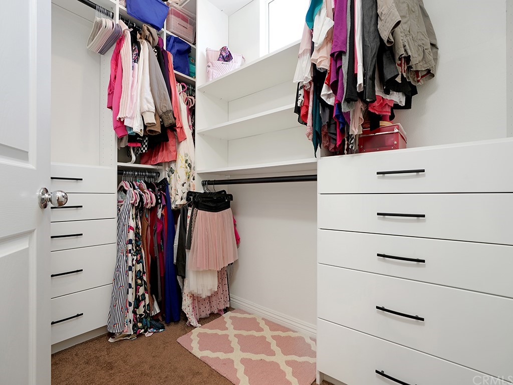 10 Westerly Aliso Viejo, CA 92656 - Photo 22 of 29 a view of walk in closet with clothes and shoes