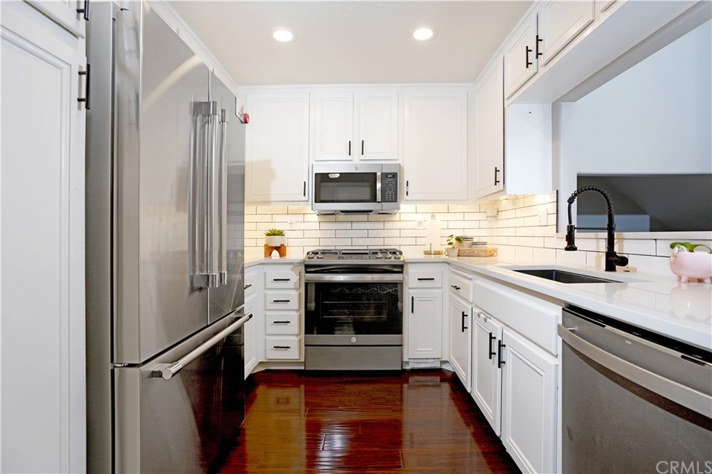 10 Westerly Aliso Viejo, CA 92656 - Photo 7 of 29 a kitchen with a sink stove and refrigerator