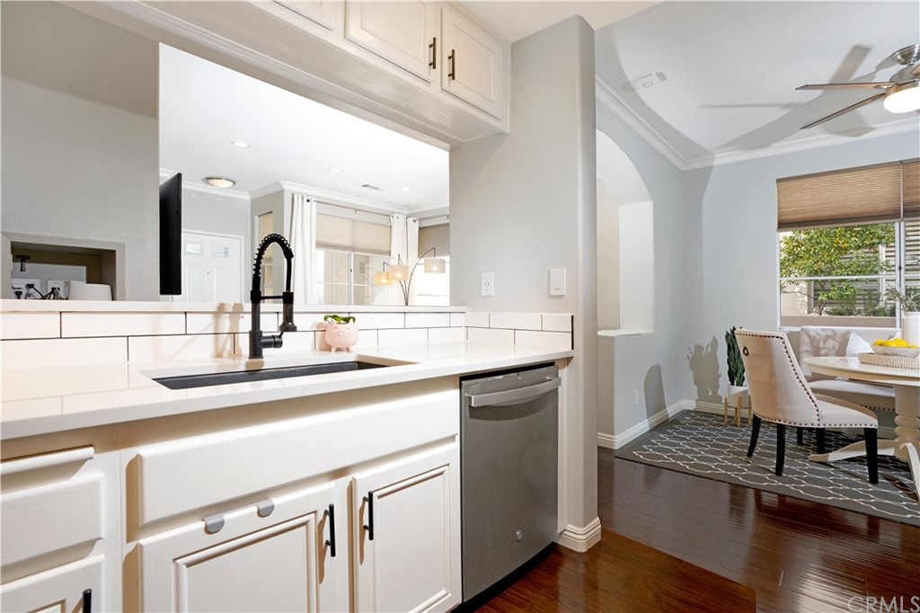 10 Westerly Aliso Viejo, CA 92656 - Photo 8 of 29 a kitchen with a sink cabinets and wooden floor