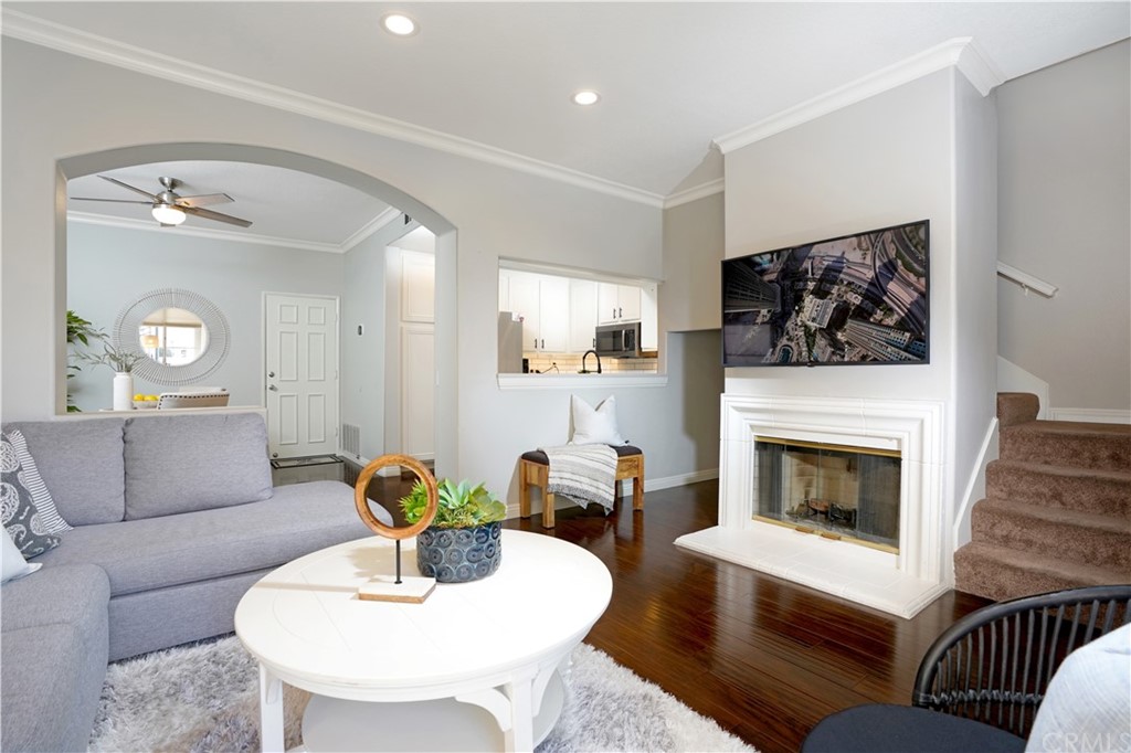 10 Westerly Aliso Viejo, CA 92656 - Photo 10 of 29 a living room with furniture a flat screen tv and a fireplace