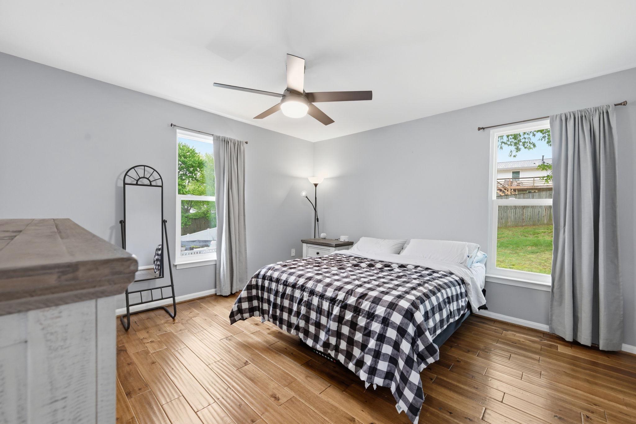 7949 Innkeeper Drive Severn, MD 21144 - Photo 20 of 51 Primary Bedroom with new ceiling fan and 3 windows