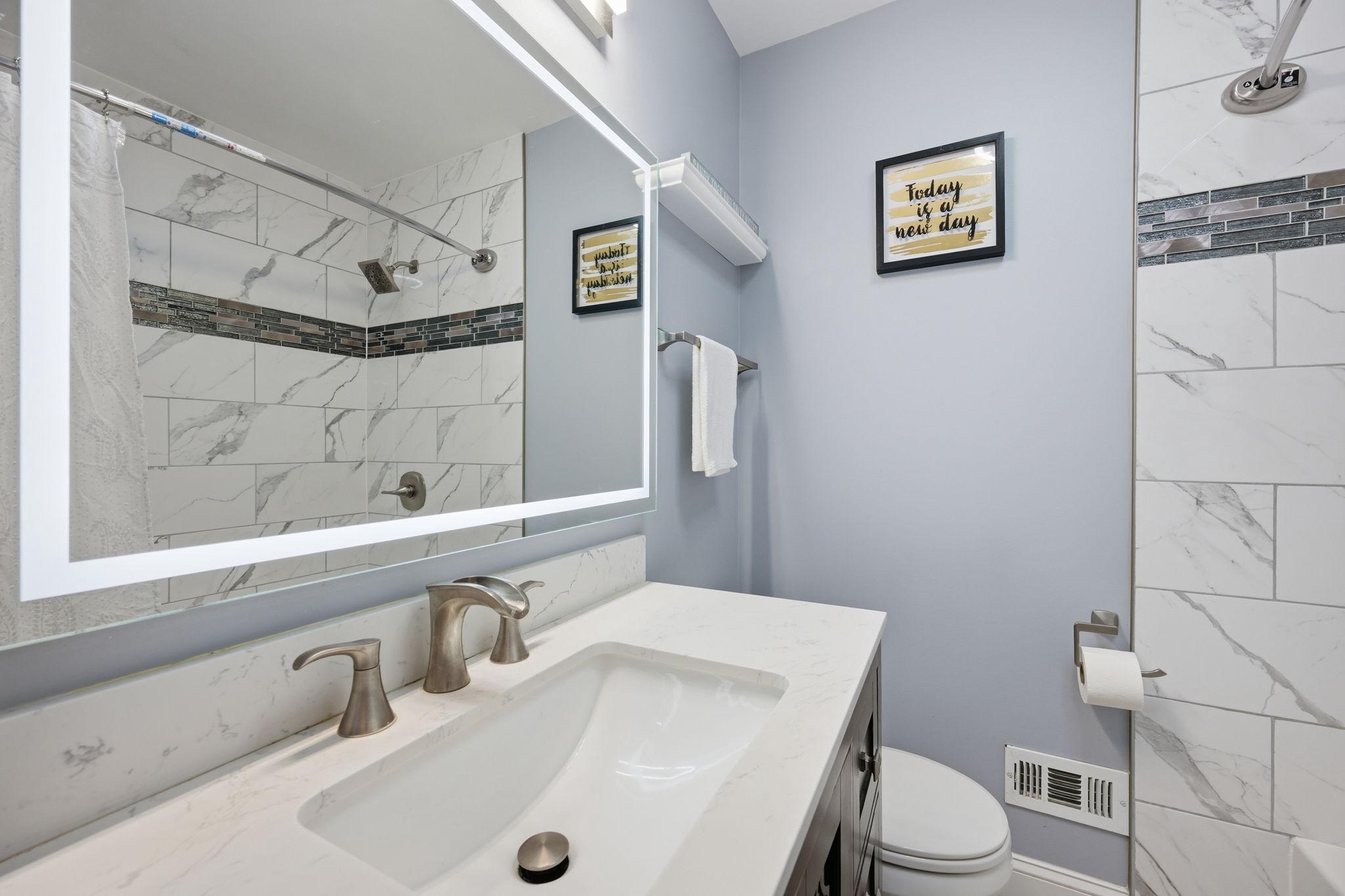 7949 Innkeeper Drive Severn, MD 21144 - Photo 27 of 51 Ceramic Tile, Upgraded Vanity & Hotel Style Mirror