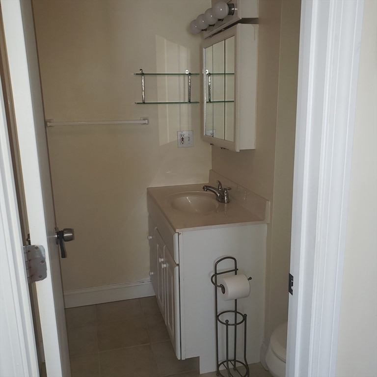 398 North End, Unit B Salisbury, MA 01952 - Photo 8 of 13 a bathroom with a shower and vanity