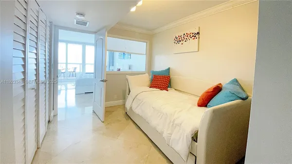 a bed room with a bed and a painting