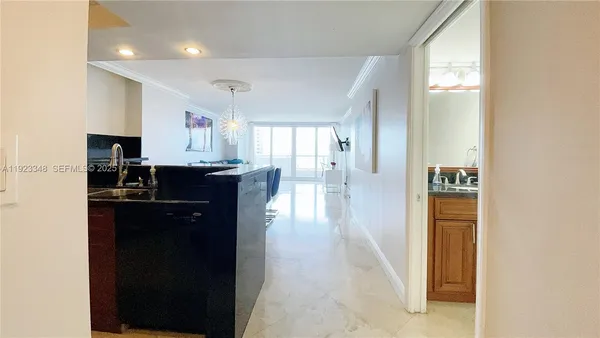 a kitchen with a refrigerator and a stove