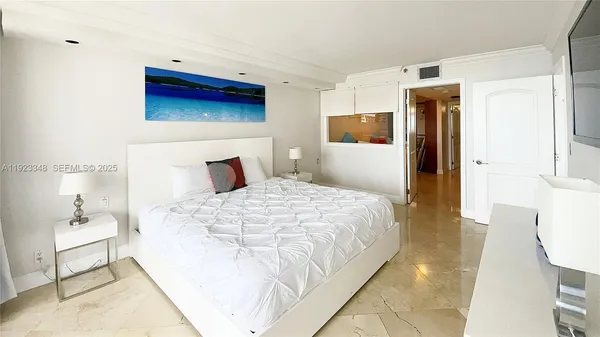 a bedroom with a bed and a couch