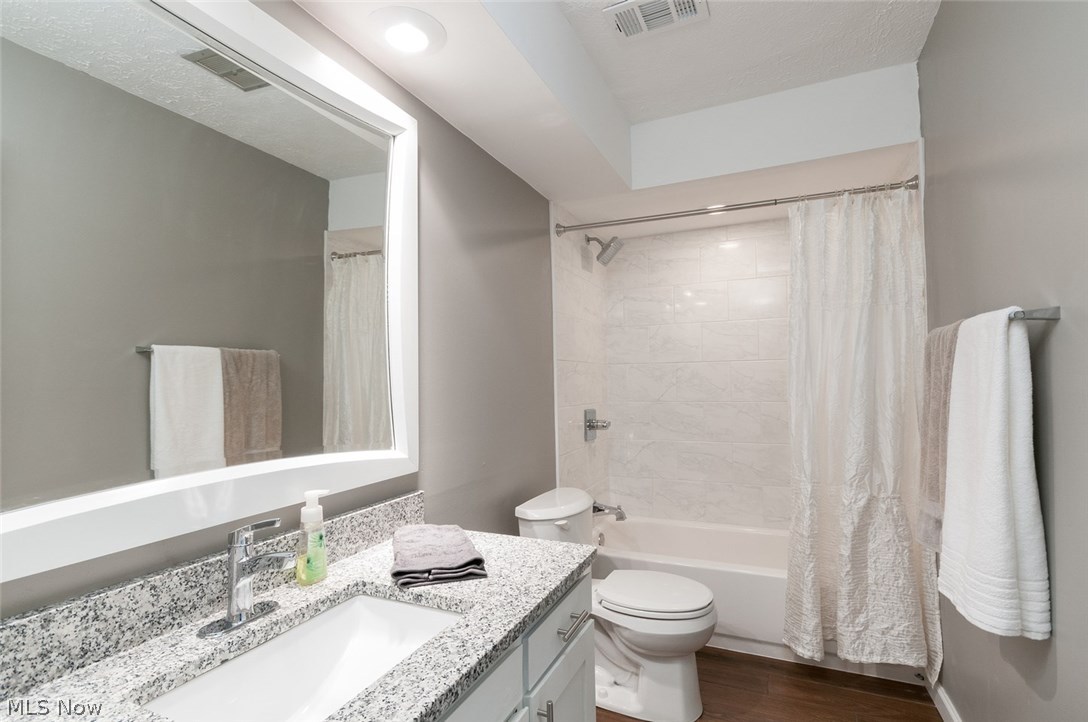 3838 West Bath Road Akron, OH 44333 - Photo 17 of 27 The new full bath the three bedrooms share features granite sink top and ceramic floor.