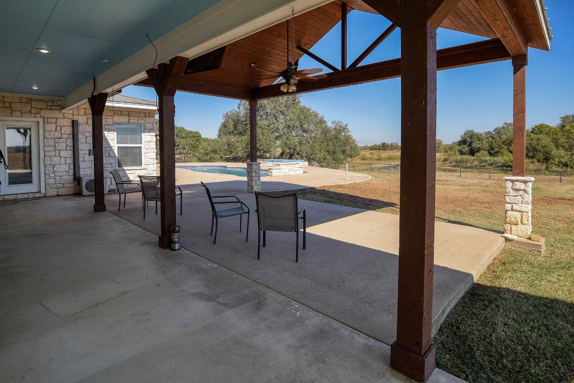 603 Watterson Road, Unit B AND C Bastrop, TX 78602 - Photo 19 of 40 a view of a porch with furniture and floor to ceiling window