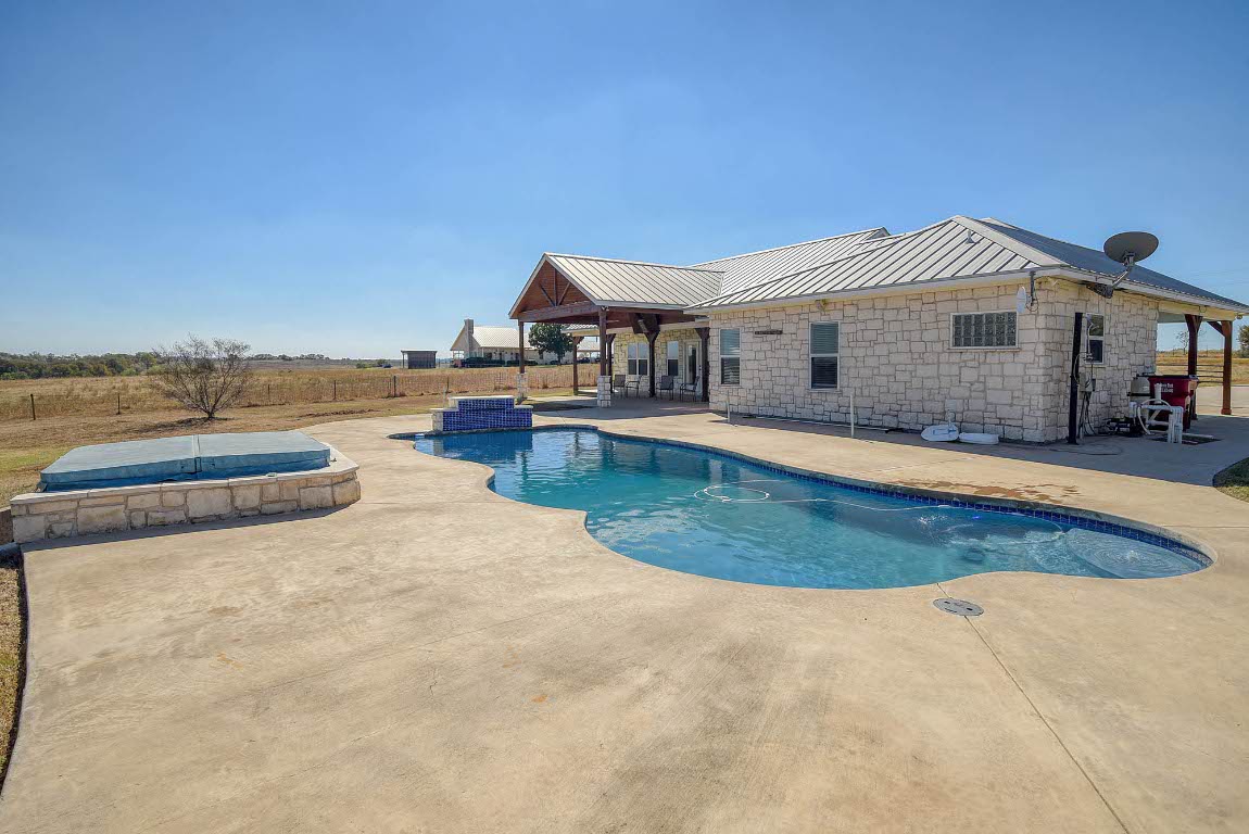 603 Watterson Road, Unit B AND C Bastrop, TX 78602 - Photo 21 of 40 a view of a house with swimming pool and sitting area