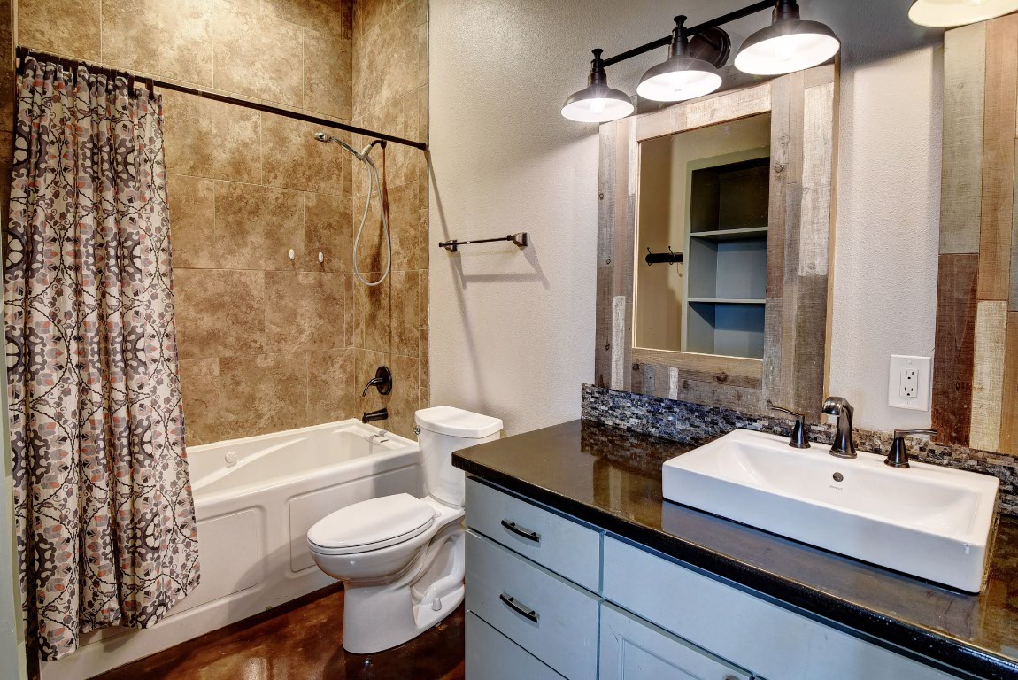 603 Watterson Road, Unit B AND C Bastrop, TX 78602 - Photo 29 of 40 a bathroom with a sink a toilet and shower