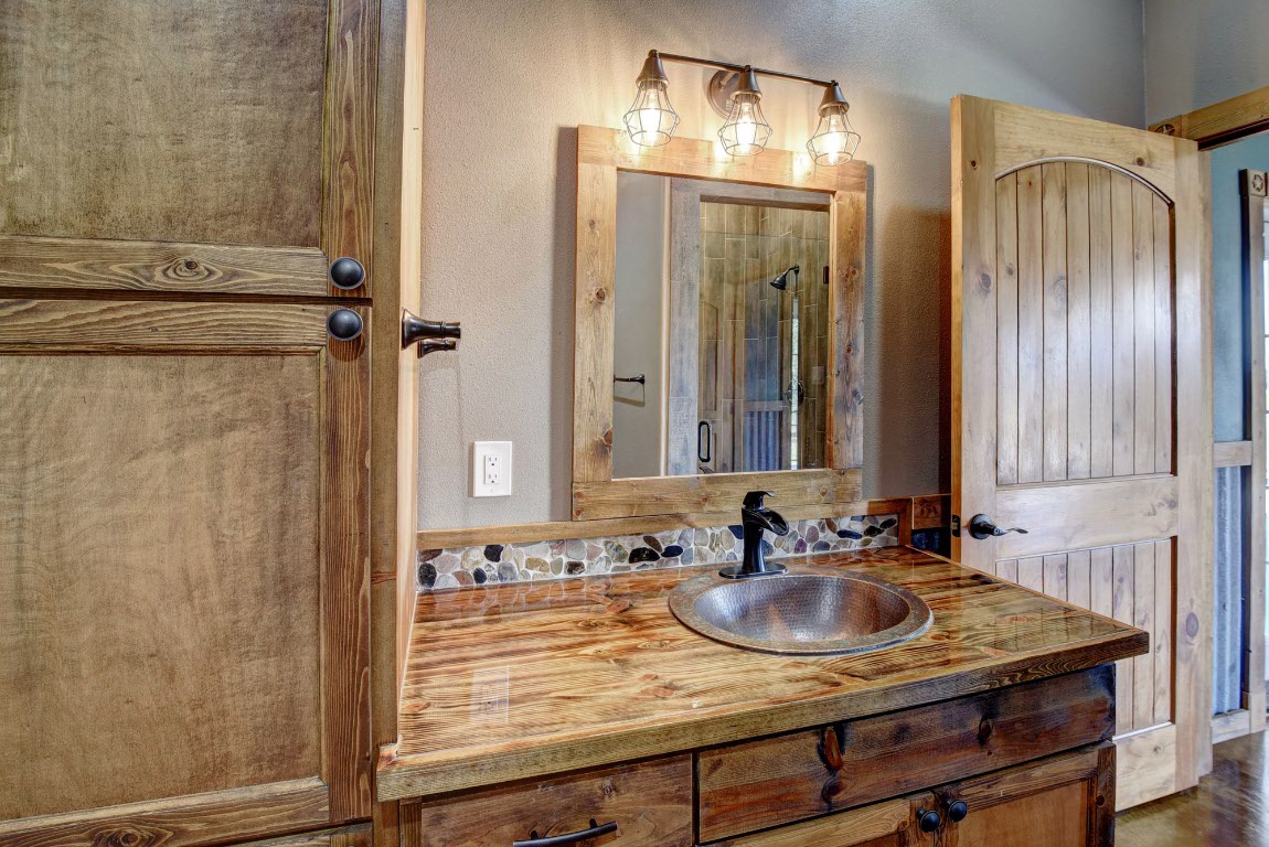 603 Watterson Road, Unit B AND C Bastrop, TX 78602 - Photo 30 of 40 a bathroom with a sink and a mirror