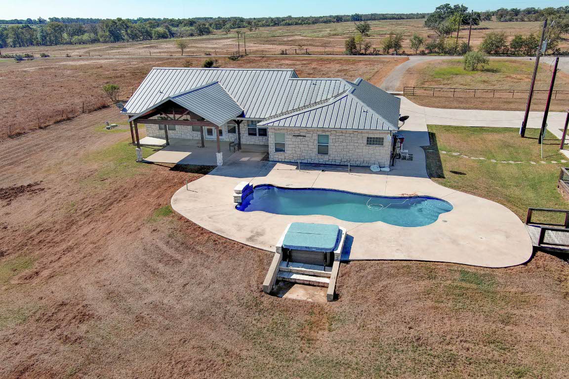 603 Watterson Road, Unit B AND C Bastrop, TX 78602 - Photo 3 of 40 an aerial view of a house with swimming pool