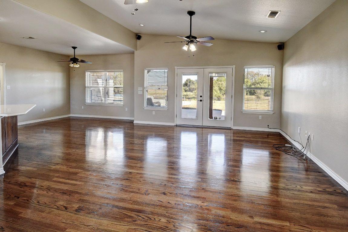 603 Watterson Road, Unit B AND C Bastrop, TX 78602 - Photo 8 of 40 an empty room with wooden floor and windows