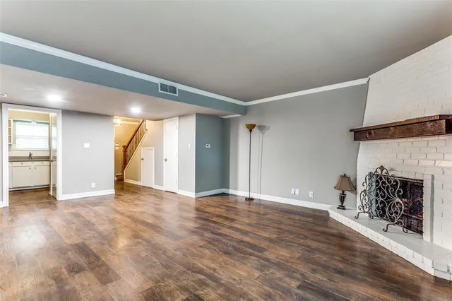 a view of livingroom with fireplace and window
