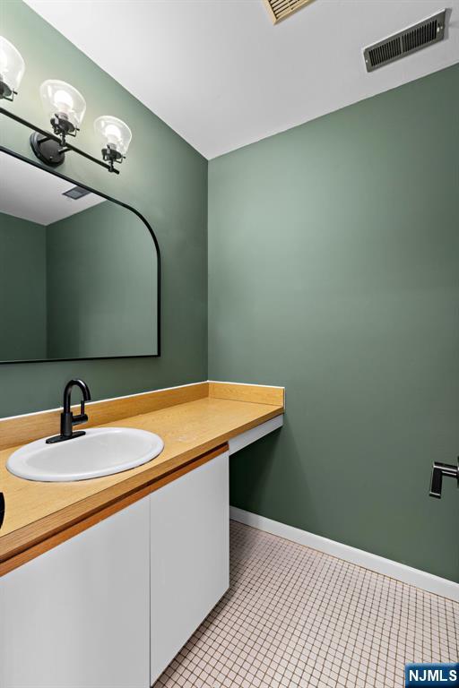 319 Gorge Road, Unit 6 Cliffside Park, NJ 07010 - Photo 10 of 24 a bathroom with a sink and a mirror
