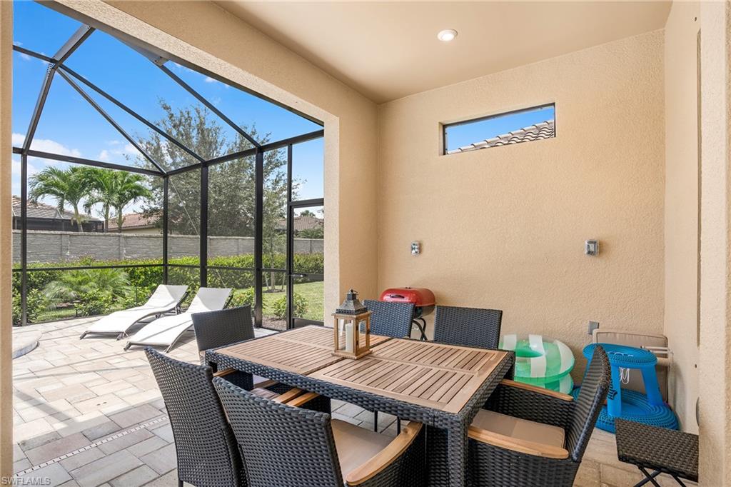 8131 Lucello Terrace North Naples, FL 34114 - Photo 11 of 32 a view of a dining room with furniture window and outside view