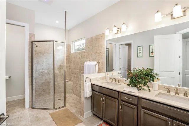 a bathroom with a double vanity sink mirror and double