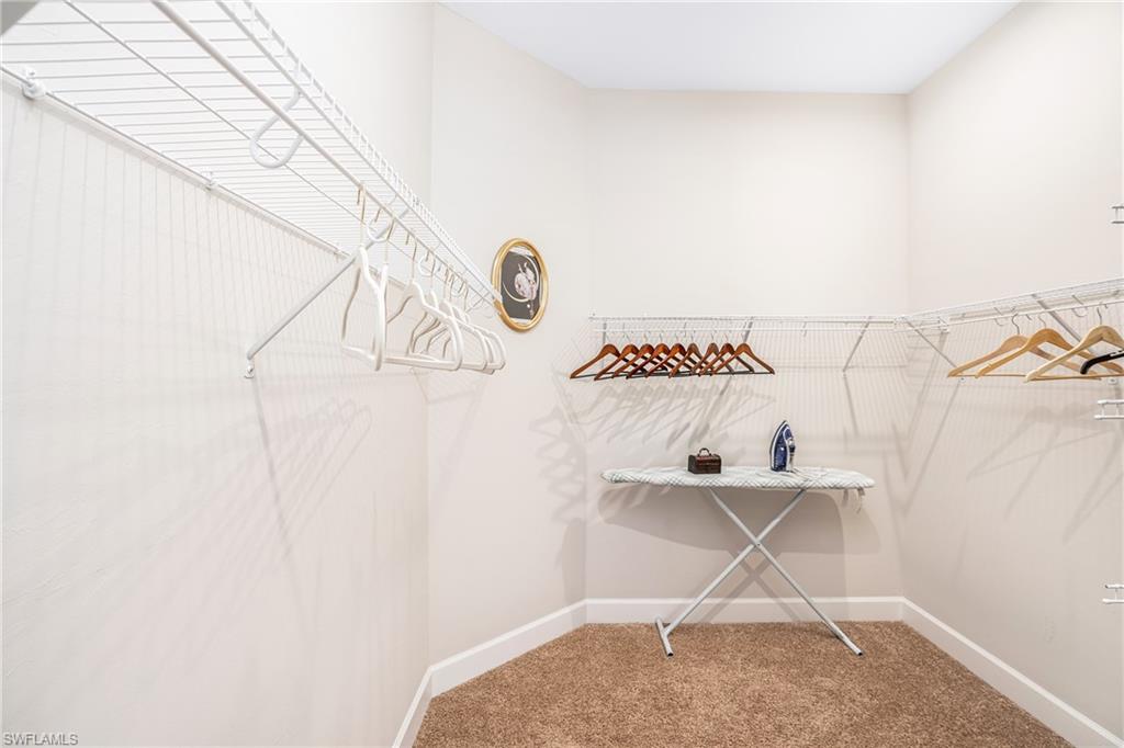 8131 Lucello Terrace North Naples, FL 34114 - Photo 15 of 32 a room with a window and a table