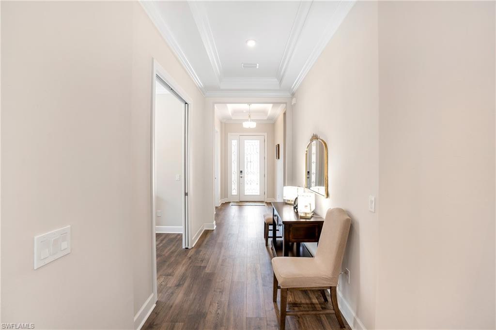 8131 Lucello Terrace North Naples, FL 34114 - Photo 16 of 32 a dining room with furniture and wooden floor