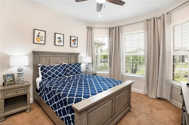 a bedroom with bed and window