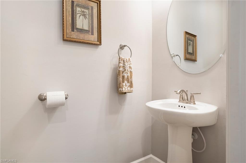 8131 Lucello Terrace North Naples, FL 34114 - Photo 24 of 32 a bathroom with a sink a mirror and a window