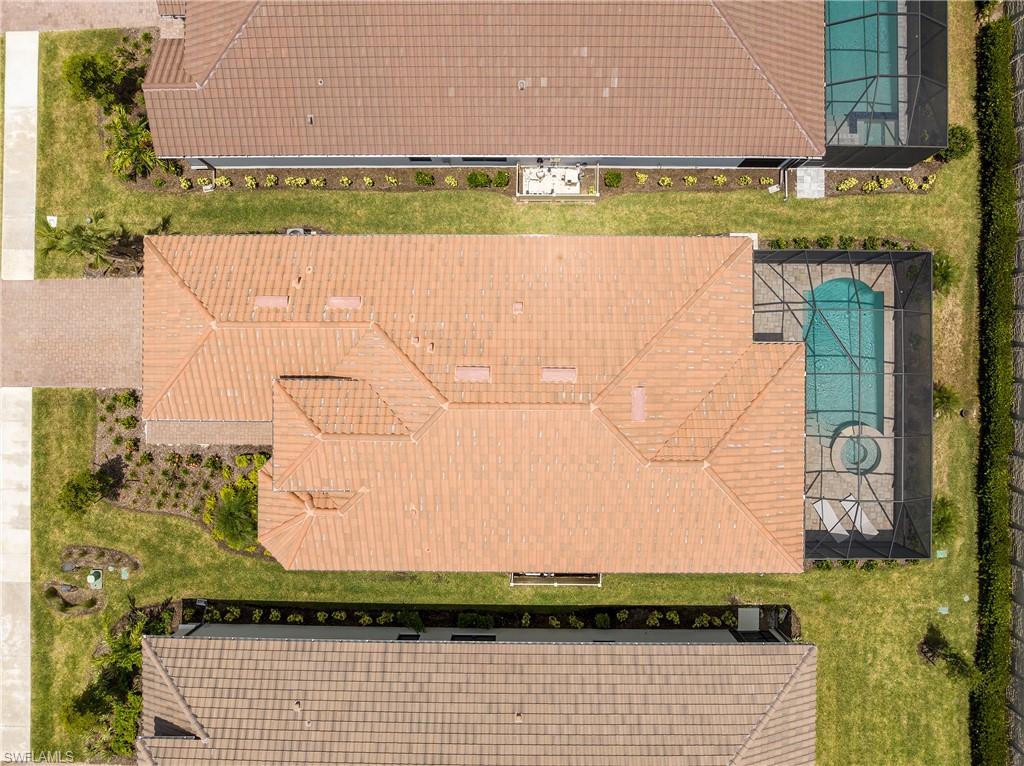 8131 Lucello Terrace North Naples, FL 34114 - Photo 25 of 32 a view of house with a yard