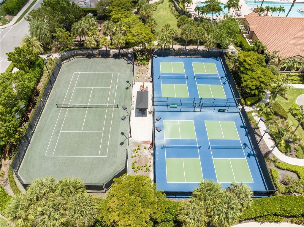 8131 Lucello Terrace North Naples, FL 34114 - Photo 29 of 32 a view of a tall building with a tree