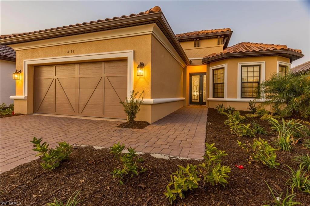 8131 Lucello Terrace North Naples, FL 34114 - Photo 32 of 32 a front view of a house with a yard