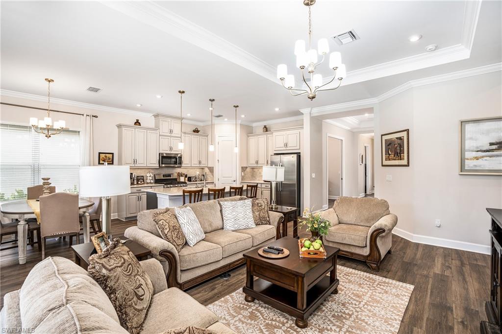 8131 Lucello Terrace North Naples, FL 34114 - Photo 5 of 32 a living room with furniture kitchen view and a chandelier