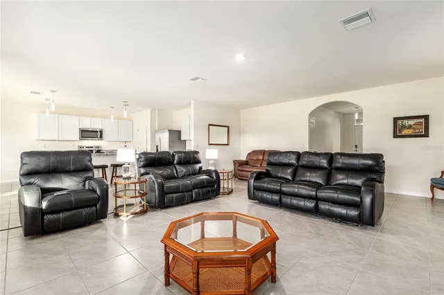 a kitchen with wooden cabinets and a stove top oven