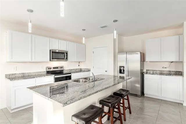 a view of a dining room kitchen and a window