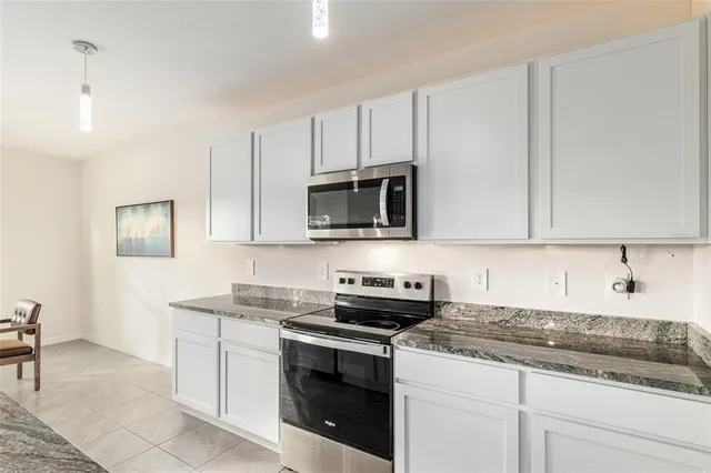 a spacious bathroom with a sink and a mirror